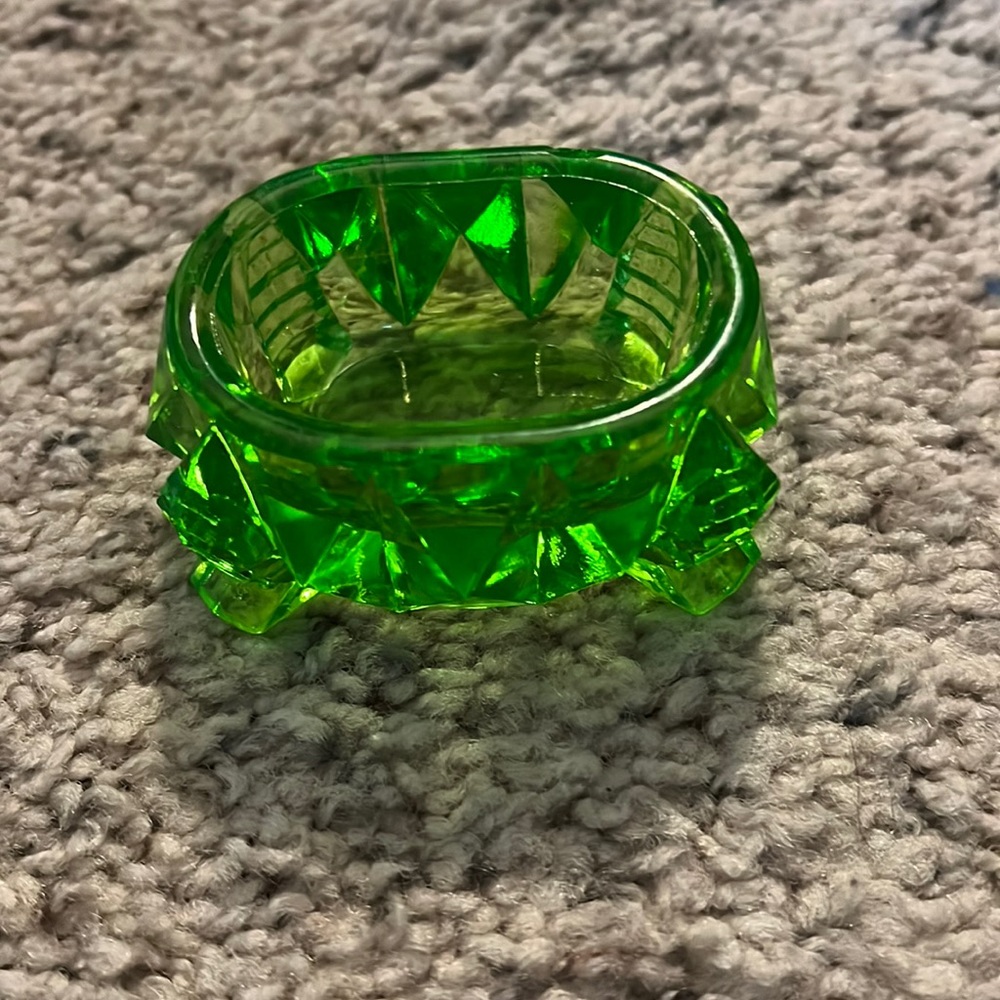 Green glass footed open salt